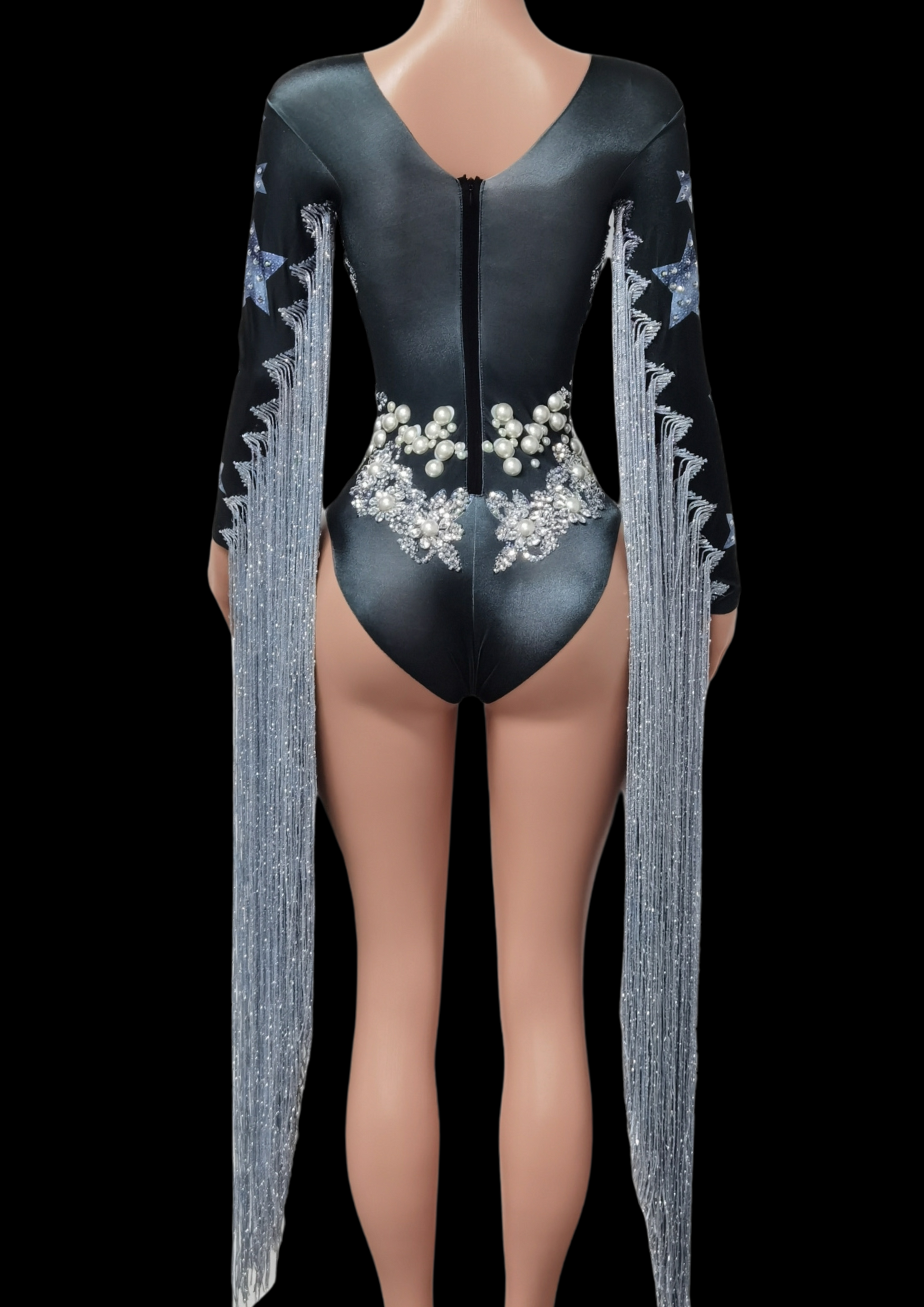 Party Romper Claire with elegant long sleeves and intricate detailing.