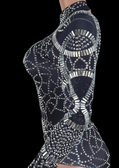 Party romper in black with intricate silver embellishments on mannequin.