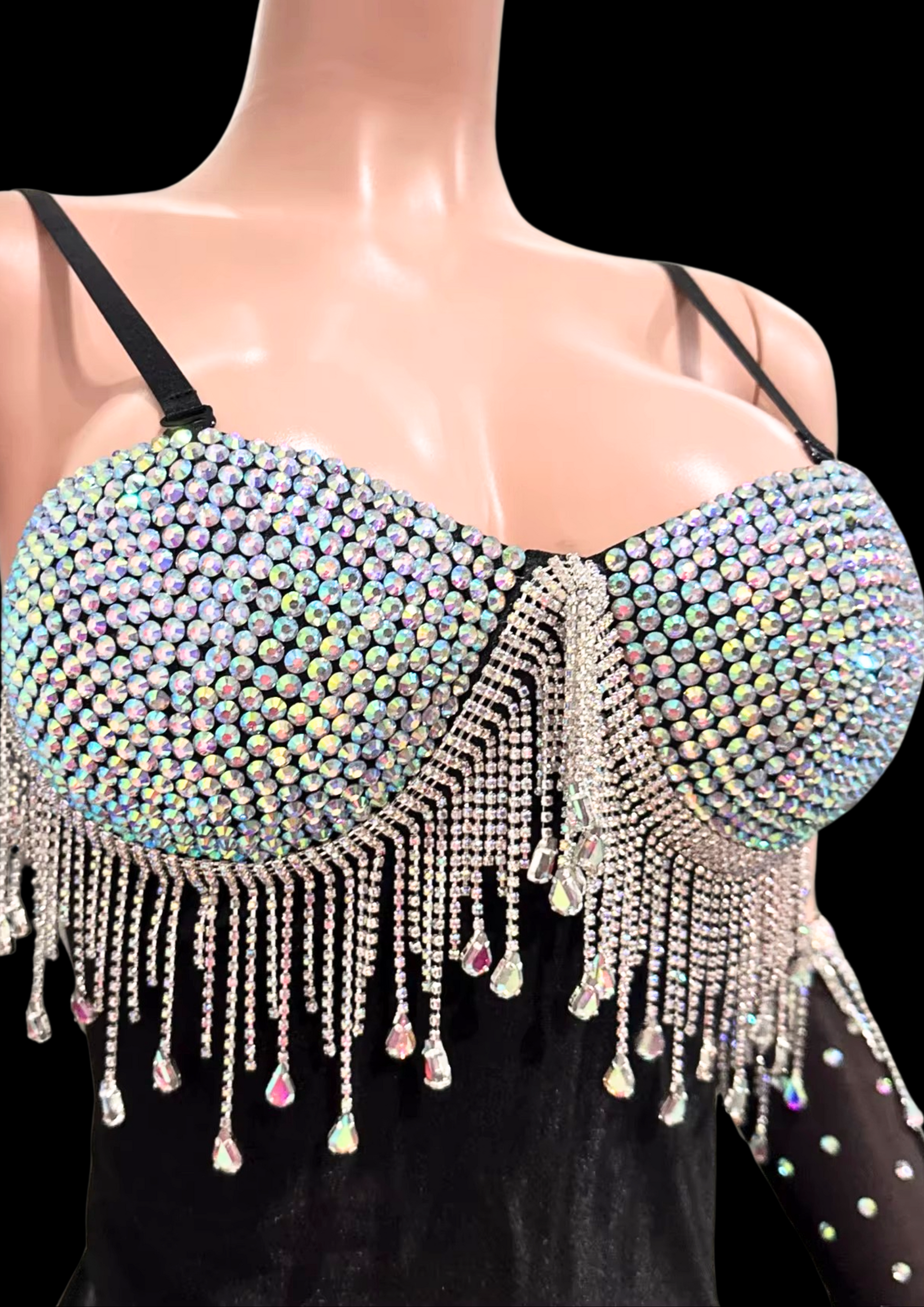 Mini dress with crystal embellishments and fringe detail on mannequin.
