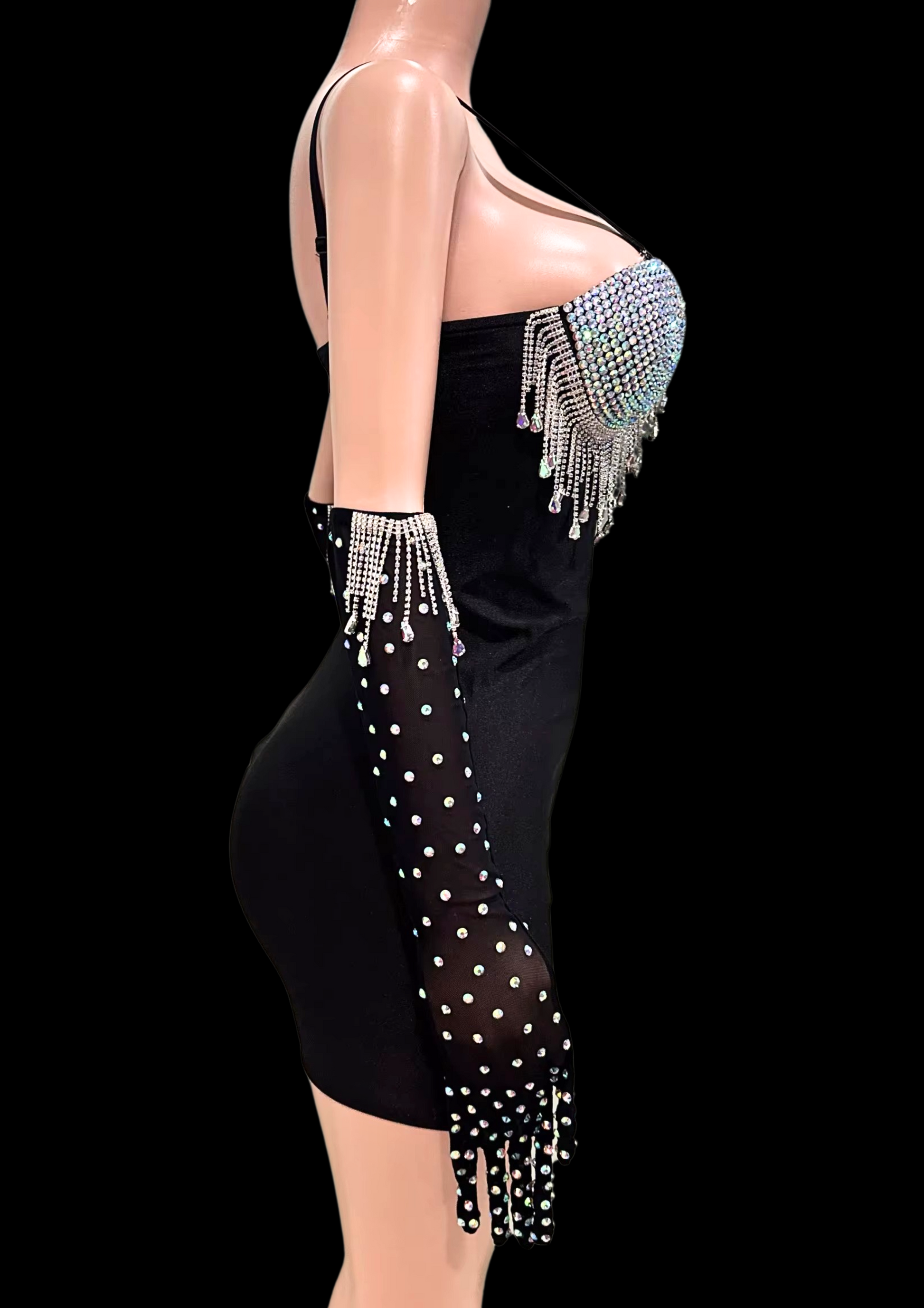 Mini dress with crystal embellishments and gloves on mannequin.