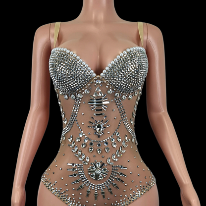 Elegant embellished party romper on mannequin display.
