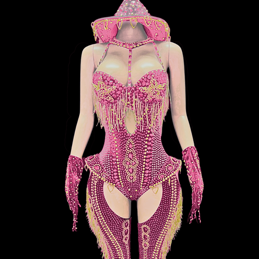 Pink rodeo-themed party costume set inspired by Beyoncé, featuring intricate embellishments and matching accessories.