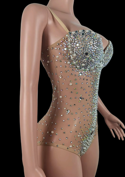 Party Romper with sparkling embellishments on mannequin.