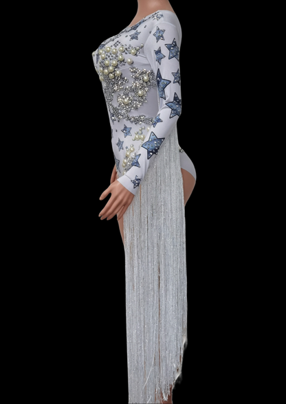 Party Romper Chloe with star patterns and fringe detailing on mannequin.