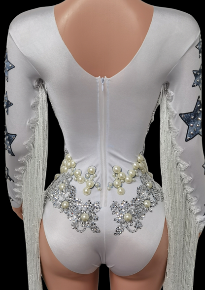 Party Romper Chloe with pearl and star embellishments on back, white color, long sleeves, fringe detail.