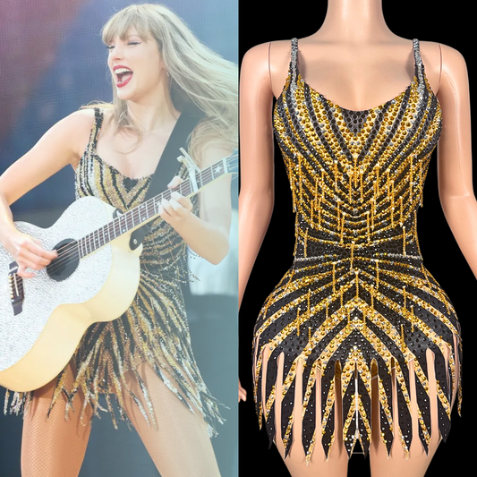 Golden party romper inspired by Taylor Swift, featuring intricate sequin patterns and fringe detailing.